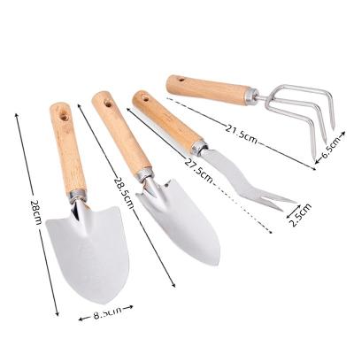 China Anti-Slip Handle Four-piece Garden Tool Kit With Stainless Steel Wood Handle for sale