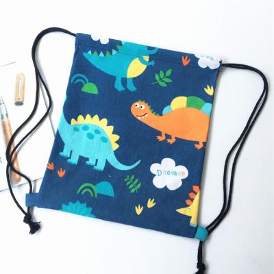 China Factory price dinosaur cotton canvas drawstring bag cartoon waterproof cute traveling foldable school bags small mini for sale