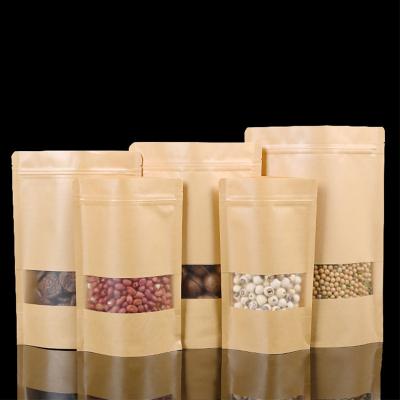 China Moisture Proof Pocket Stand Food Packaging Bag Paper Packaging Ziplock Paper Bag With Window for sale