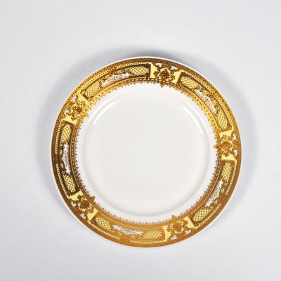 China Wholesale Elegant Gold Rim Exotic Wedding Stocked Round Shape Ceramic Charger Dish for sale