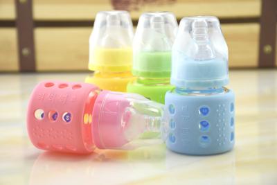 China 60ml Borosilicate Baby Glass Water Bottle Silicone Sleeve With Teat For Milk for sale