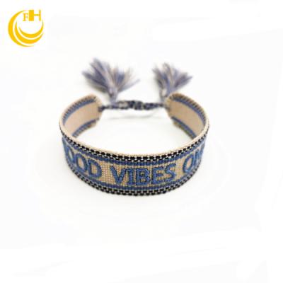 China Hot tenacity fabric custom wristband with texts. Fabric wristband with text logo for sale