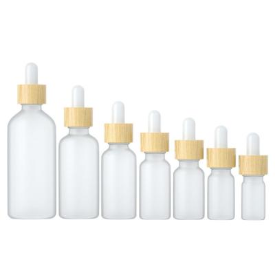 China 10ml cosmetic frosted essential oil glass cosmetic bottle with bamboo dropper for sale