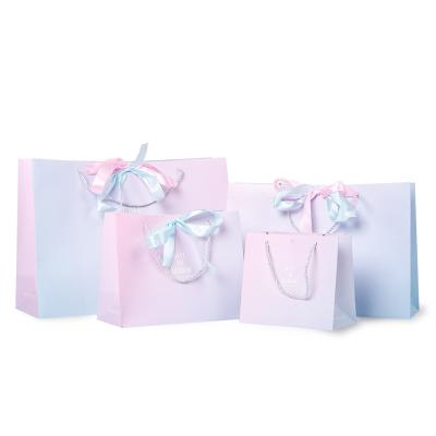 China Recycled Materials Packaging Gift Box Christmas Gift Wrapping Gift Box Paper Bags With Ribbon Shopping Bag for sale