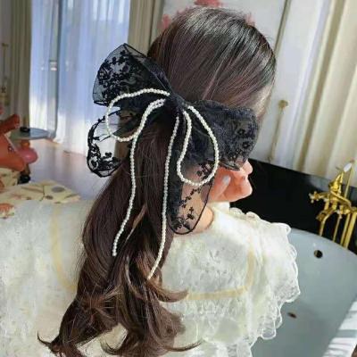 China 2021SS Elegant Hollow Lace Up With Beads Decorated Classic Black And White Colors Ladies' Hair Clip Headband for sale