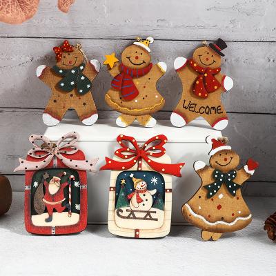 China WOODEN Wholesale Creative Wood Pendant Christmas Day Decorations Multi Style Holiday Decoration Pendant for sale