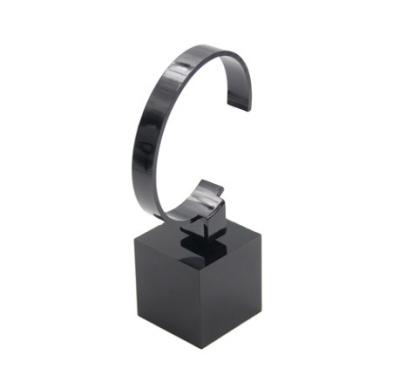 China OEM are available logo printed elegant luxurious black and transparent acrylic display riser for watch in counters display for sale