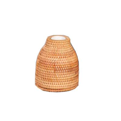 China Minimalist Modern Rattan Wrapped Irrigation Green Plant Ceramic Bottle for sale