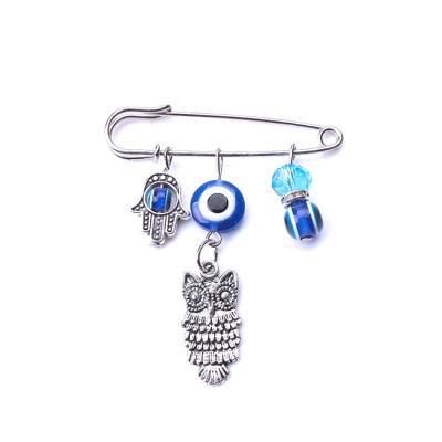 China ALLOY Fashion Palm Brooch Owl Blue Eye Hand Crystal Brooch Handmade Pin for sale