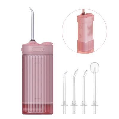 China New 3-Speed ​​Adjustable Water Flosser 4-Nozzle Removable Smart Tooth Water Tank Rinser Pulse Tooth Scaler for sale