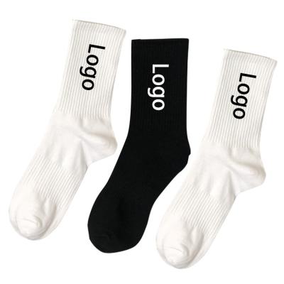 China Breathable Male Letters Sports Black And White Socks Color Custom Logo Mens Fashion Cotton Crew Socks for sale