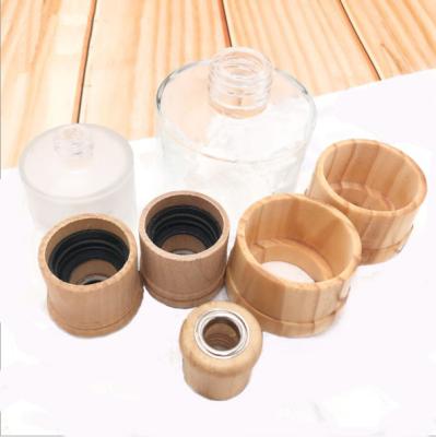 China 2020 non refillable custom design kinds of birch wooden cap covers with hole to spread incense for perfume glass for sale