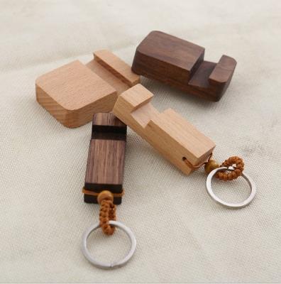 China Custom cheap cute beech wooden phone bracket diy bracket for sale