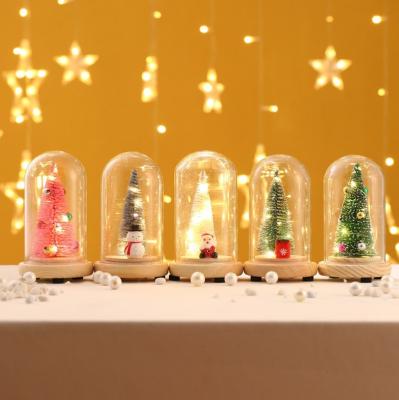 China Creative Mini Gifts Christmas Gift Glass Cover Wooden Luminous Christmas Tree Desktop Ornaments for sale