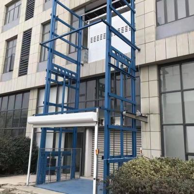 China 5000 kg Outdoor Cargo Lift 7m Mezzanine Lifts Warehouse Freight Lift Te koop