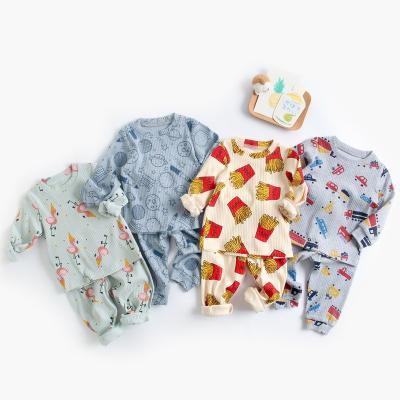 China Breathable Warm Autumn Baby Clothes Set Long Sleeve Cartoon Print Ribbed Cotton Baby Kids Clothes Pajama Suit for sale