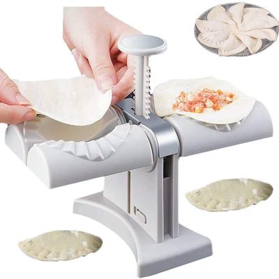 China Sustainable Manual Press Dumpling Wrapper Tool Household Double Head Automatic Dumpling Maker Mould Household Double Empanada Molde for sale