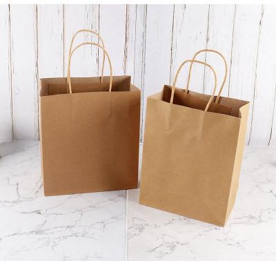 China Biodegradable Custom Logo Paper Kraft Paper Gift Bags Shopping Bag With Your Own Logo for sale