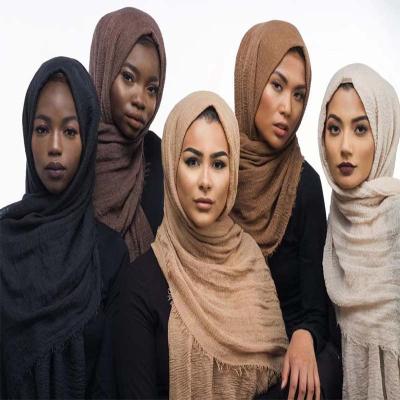 China Women's Casual Wholesale Muslim Cotton Scarf Thin Canvas Sunscreen Wraps Solid Color Girl Plain Scarf Turban Ethnic Female Hijab Scarf for sale