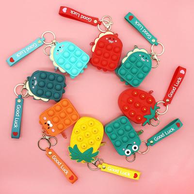 China Funny Educational Toy Creative Design Relaxation Bubbles Noise Busy Person Toys Silicone Coin Purse Pocket Change Wallet Bag Key Chain for sale