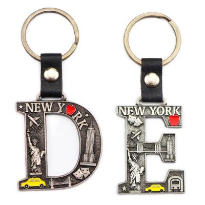 China Zinc Alloy Cheaper Price Luxury PU Leather New Nork Souvenirs Custom Letter Shape Metal Double Sided Key Chain for sale