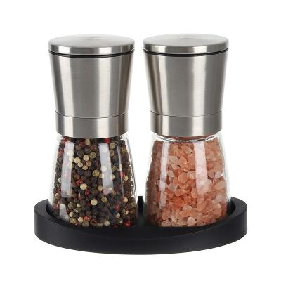 China Sustainable Salt and Pepper Grinder Set Stainless Steel Adjustable Coarseness Ceramic Pepper Mill Salt Crusher with Silicone Tray Salt and P for sale