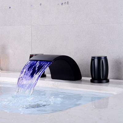 China Waterfall Sensor Adjustment LED Metered Faucet Black Three-hole Basin Faucets Cooling And Heating Outlet for sale