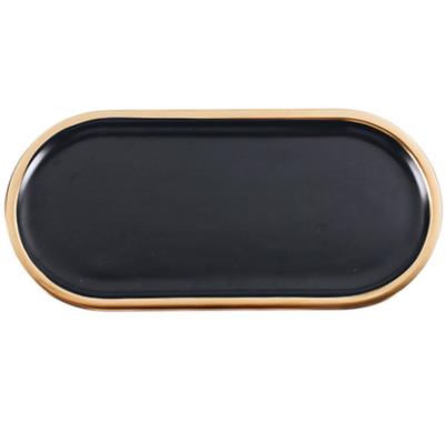 China Nordic Creative Black Creative Jewelry Dish Oval Porcelain Gold Ceramic Dessert Tray for sale