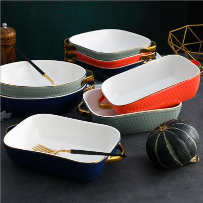 China Viable Use Paella Baking Tray Creative Tableware Ceramic Microwave Oven Baking Tray With Gold Handle for sale