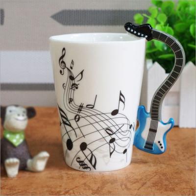 China Viable Novelty Guitar Handle Creative Music Lovers Milk Tea Water Ceramic Coffee Mugs For Gift for sale