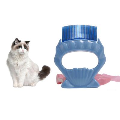 China Sustainable Pet Care Products Shell Shape Cat Shaped Brush Shedding Comb For Cats Pet Grooming Supplies for sale