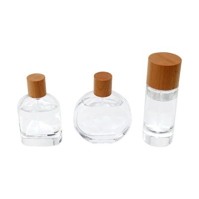 China Non Spill Custom White Lid Ash Wood Walnut Beech China Logo Luxury Wooden Perfume Bottle Caps for sale