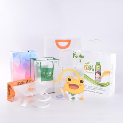 China Recycled Materials Durable Using Cheap Price Pink Clear Plastic Bags For Packaging With Handle for sale