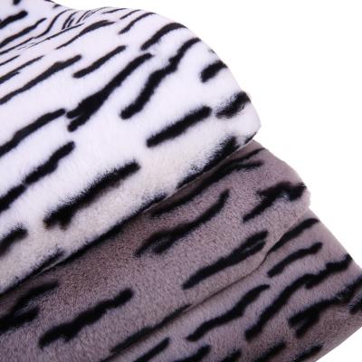 China Wholesale Tear-resistant Rabbit Fur Wholesale Faux Long Pile Plush Polyester Print Knitted Fabric For Scarf Earmuff Cover for sale