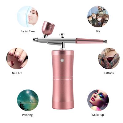 China Portable Makeup Airbrush Compressor Electric Paint Airbrush Gun Cosmetics Aerosol Paint Mini Makeup Air Compressor for sale