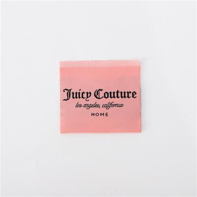 China Washable Care Reference Cleaning Tips Label Pink Fabric Woven Label Ply Woven Label for sale