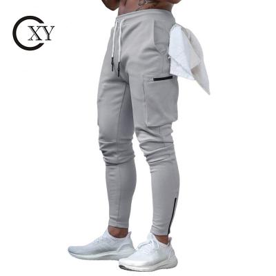 China Hot Selling Cotton Anti-wrinkle Pocket Design Drawstring Design Multi Running Sport Gym Cargo Male Sports Tracksuit Hot Custom Organic Training For Men for sale