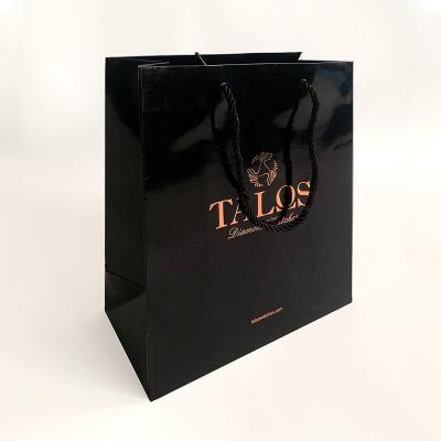 China Logo Black Glossy Paper Bag Customized Handled With Rope Handle Gift Shopping Bag for sale