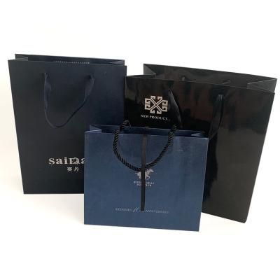 China Fashion Ribbon Handle Handmade Luxury Black Paper Shopping Bag Eco Friendly Gift Packaging Bags for sale