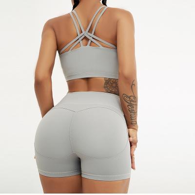 China Breathable Hot Selling Cross Ties Sports Bra Peach Hips Tight Yoga Shorts Two Piece Active Wear Set Legging And Bra Fitness Suit for sale