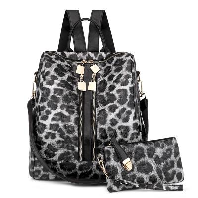 China 2pcs/set Fashion Leopard Waterproof Women And Cow Print Zipper Travel Backpack With Strap School Luxury Soft Leather Shoulder Bag for sale