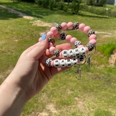 China New Fashion Leopard Cow Pattern Silicone Beaded Bracelet Key Chain For Mom Gift Car Key Holder Letter Bangle Key Chain Bag Pendant for sale