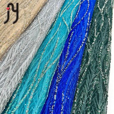 China OEM elastic custom lace and handmade rhinestone french glue stoned lace fabric lace for wedding party for sale