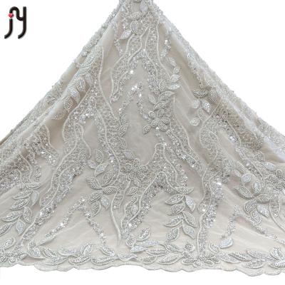 China 2022 Viable New Arrival High Quality Nigerian White Bridal Lace Fabric 3-5mm Sequin Net Silver Beaded Embroidery Lace Fabric for sale