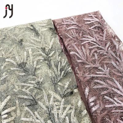 China Viable Net Fabric Small Sapling Embroidered Nigeria French Lace Stones Embroidered 100% Polyester Making Dress Rhinestones Decorated for sale