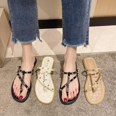 China Roman style rivet set-toe slippers women's outer wear non-slip 2022 summer new flat-heeled flat-bottomed sandals for sale