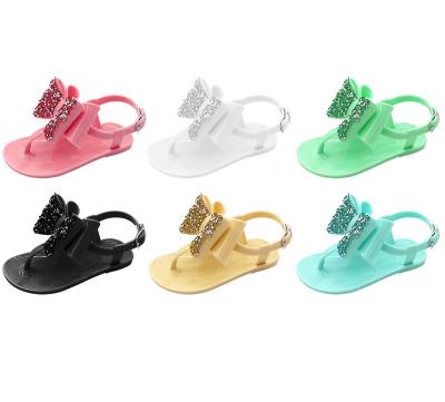 China Wholesale cute children's jelly shoes girls kids flip flop glittering bowknot PVC flat sandals for sale