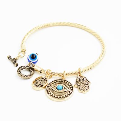 China TRENDY hot sale simple design rhinestone eye shape bracelet gold blue eye form bracelet women's jewelry for sale