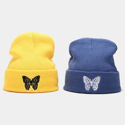 China JOINT fashion warm knit hat winter hat ladies men women butterfly embroidery soft elastic beanie for sale