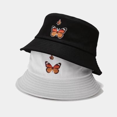 China Breathable Comfort Unisex Butterfly Embroidered Bucket Hats Outdoor Beach Sun Covers Foldable Fin Hats Street Fisherman Hat for sale